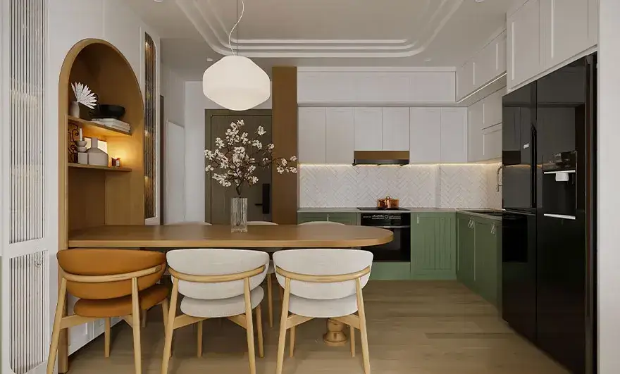 L-shaped modular kitchen design featuring a minimalist open layout with white and green accents, complemented by wooden furniture in the dining area for a fresh and inviting atmosphere.