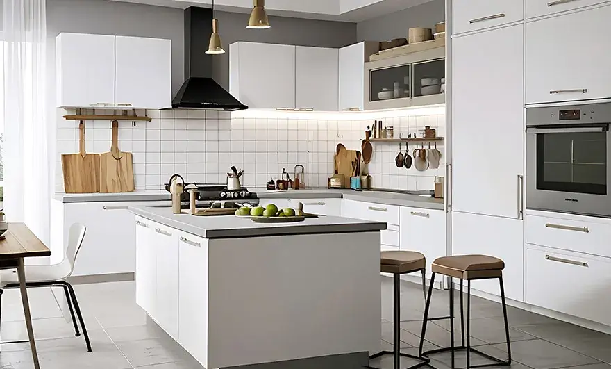 L-shaped modular kitchen design featuring a sleek white countertop and a bar with stools, creating a modern and functional space perfect for casual dining and entertaining.