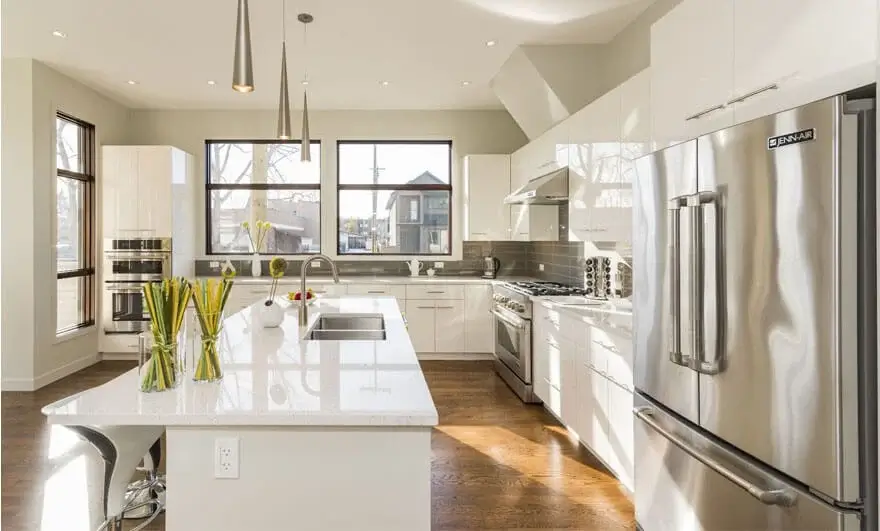 Beautiful shot of a modern house kitchen featuring a parallel modular kitchen design with sleek cabinets and contemporary appliances.
